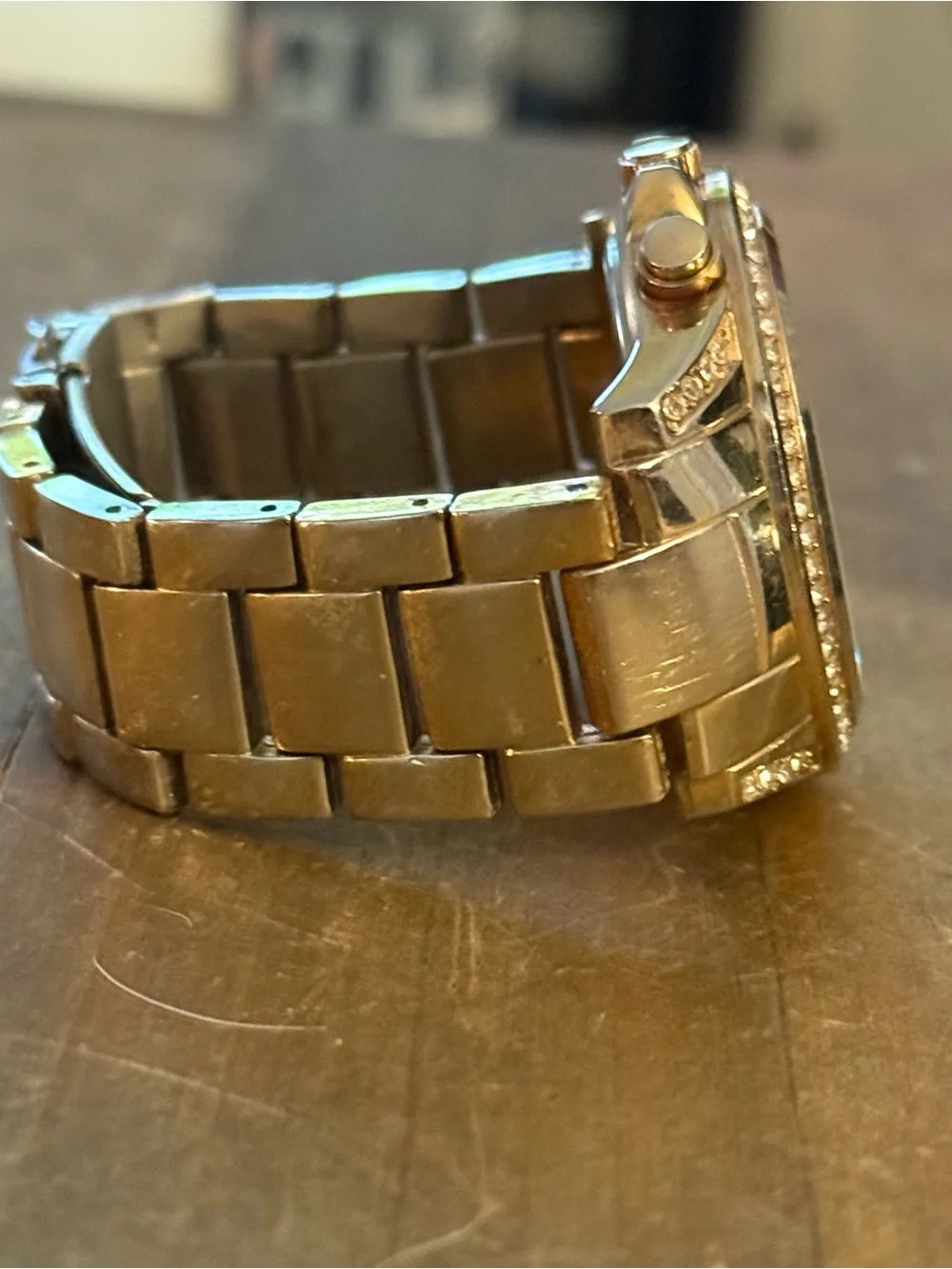 Unlisted by Kenneth Cole gold stainless steel crystal bezel watch